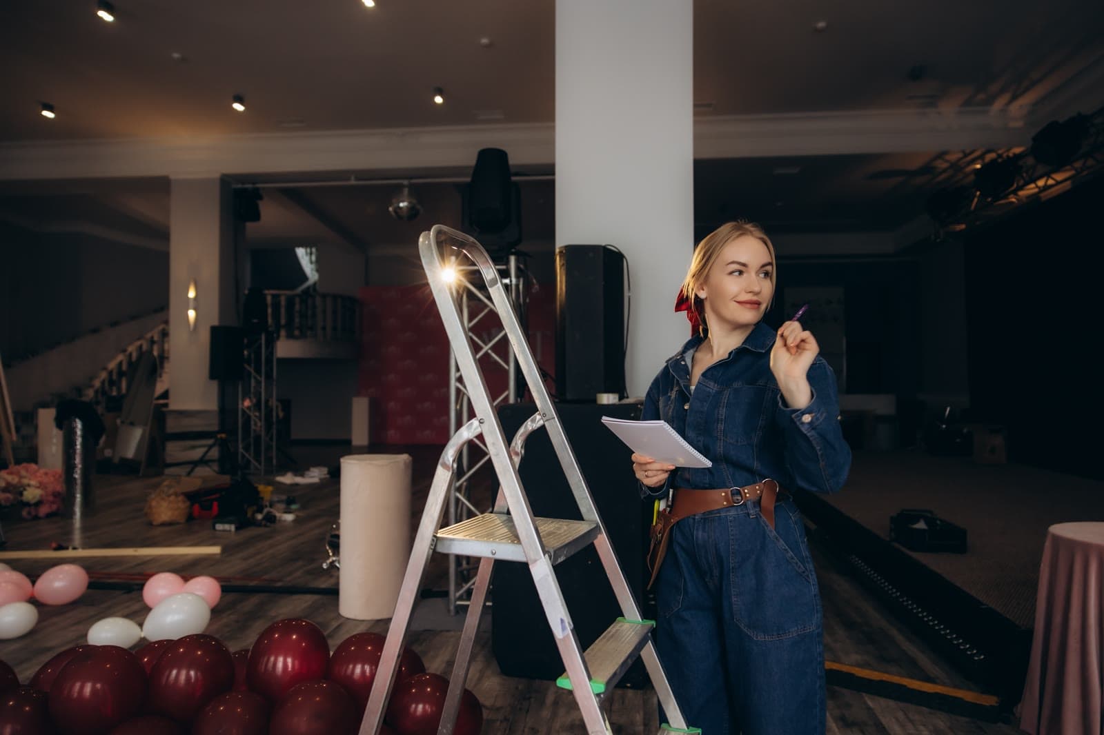 Event planner reviewing details during venue setup